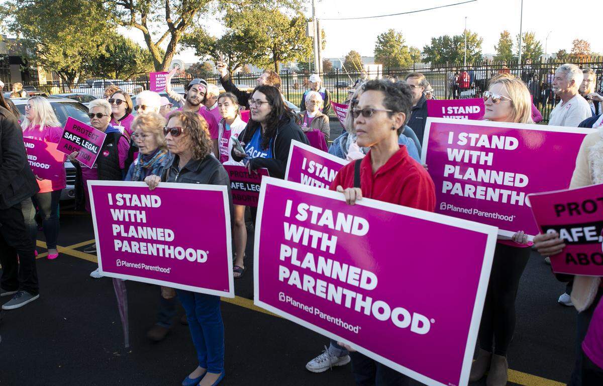 Planned Parenthood supporters listen to speakers during a rally and ribbon-cutting ceremony at the new Fairview Heights clinic.