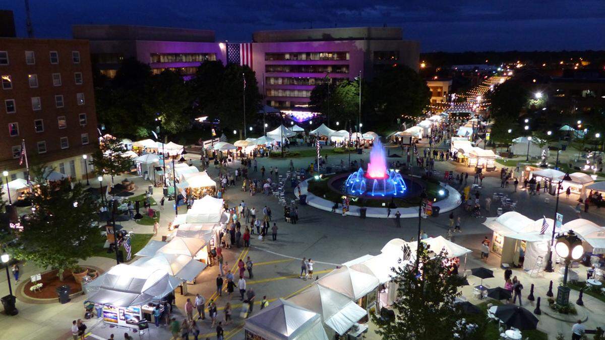 Tents and the fountain glow at night during Art on the Square in this undated photo.