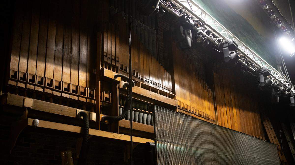 The late Richard Wright, who bought the Lincoln Theatre in Belleville in 1980, rebuilt its pipe organ, which was dedicated in 1996. Rows of pipes are mounted on the back wall, behind the stage.
