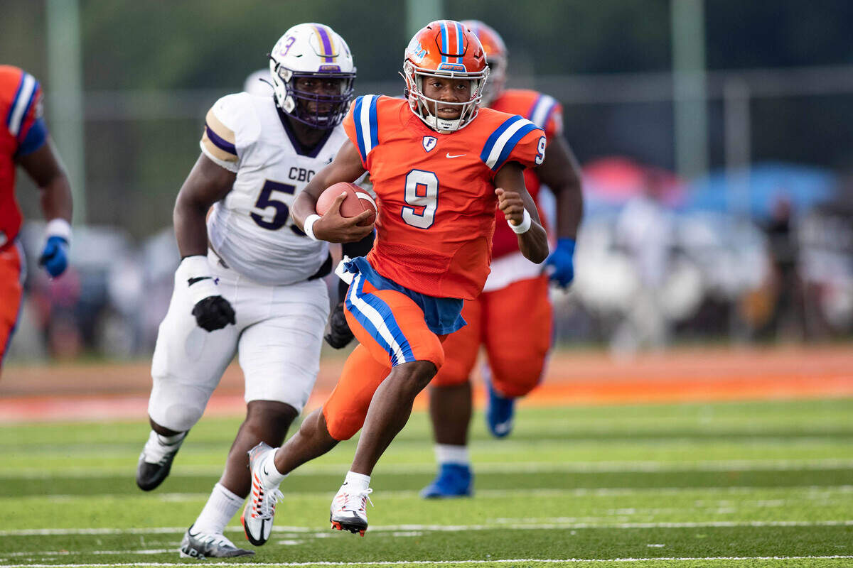 September 3, 2022 - East St. Louis, IL - East St. Louis quarterback Robert Battle carries the ball during the annual Gateway Scholars Football Classic football game between CBC and East St. Louis. East St. Louis went on to a 64 to 19 win. [Photo: Chris Johns]