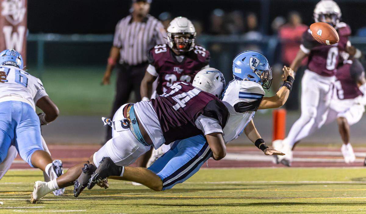 Belleville West’s Kevin Stallings Jr makes the big tackle against East at Goalby Field Friday.