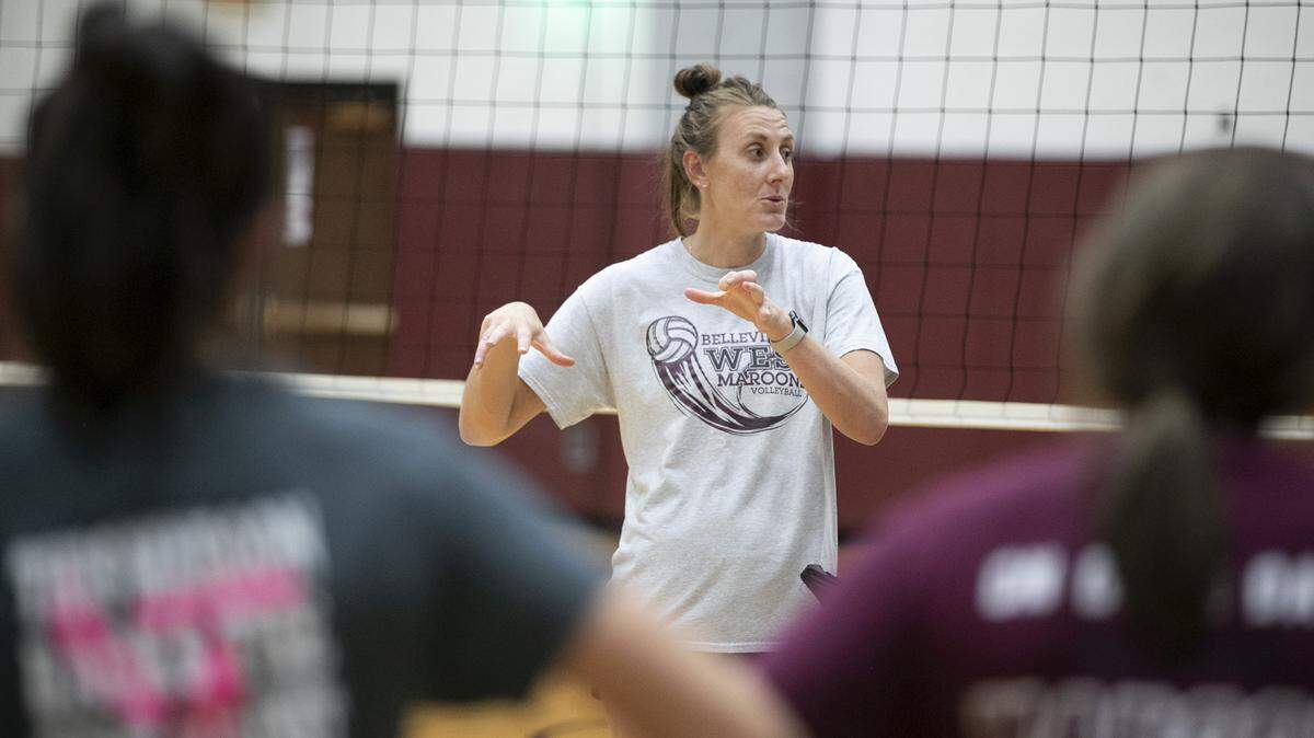 Belleville West volleyball coach Lauren DeGirolamo works with players during a recent practice.