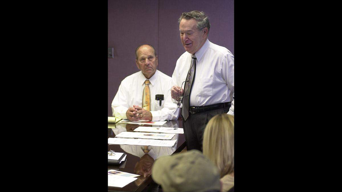 In this early 2006 file photo, Fairview Heights Mayor Gail Mitchell listens to former Fairview Heights Mayor George Lanxon talk about the memorial project to be built in Long Acre Park.