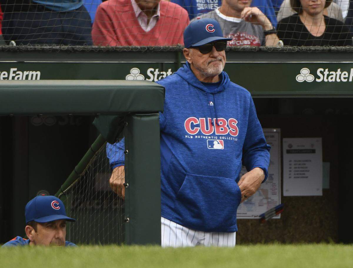 Chicago Cubs manager Joe Maddon (70) looks on after Milwaukee Brewers’ Domingo Santana (16) scores during the eighth inning of a tie break baseball game against the Chicago Cubs on Monday, Oct. 1, 2018, in Chicago. (AP Photo/Matt Marton)