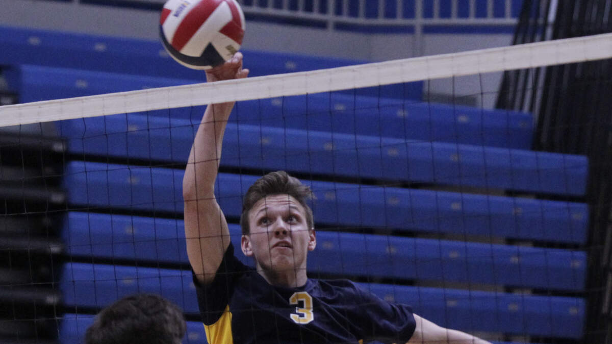 Connor Sheehan of O'Fallon spikes the ball in the Panthers' home opener against Granite City