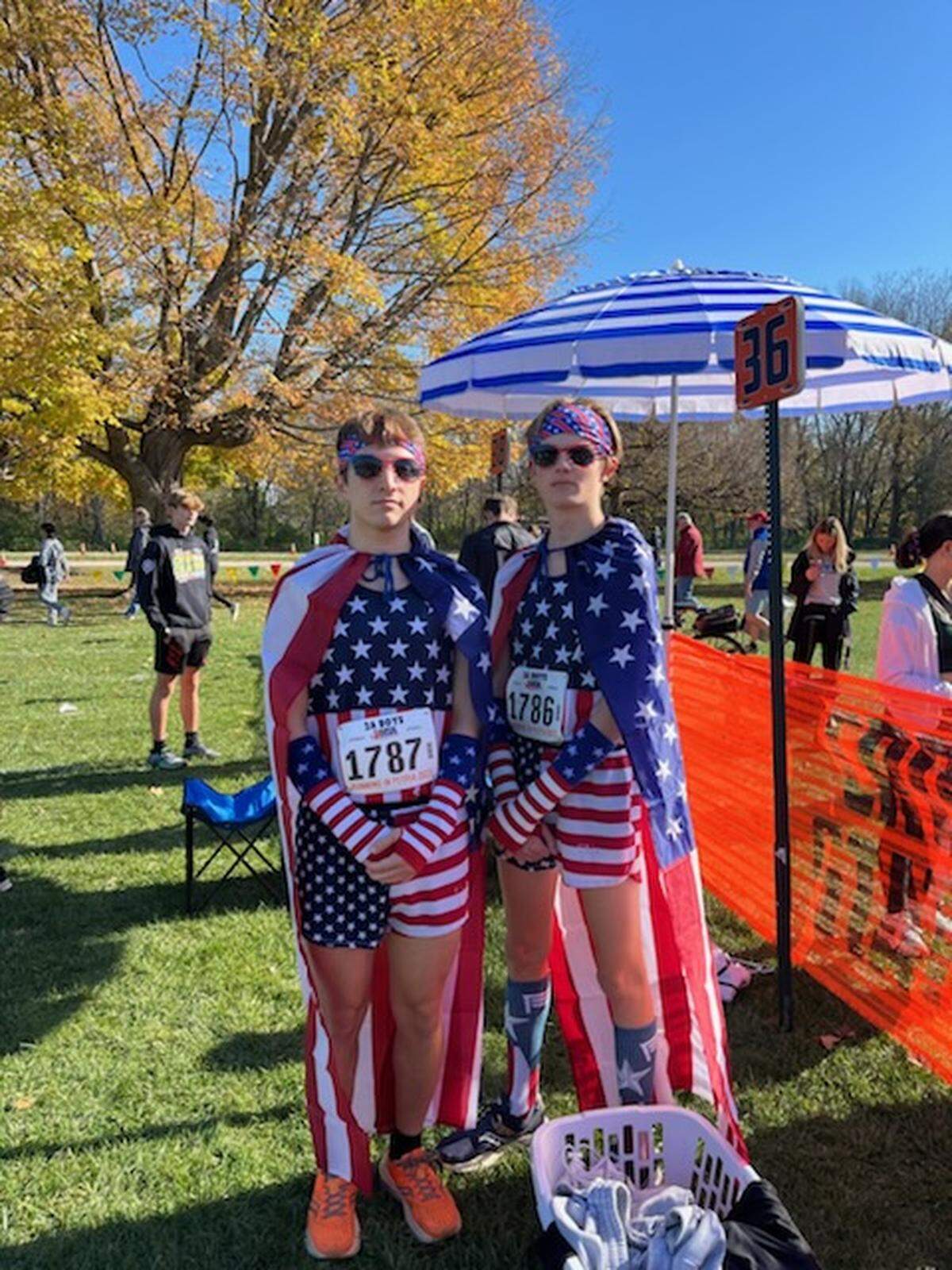 Highland runners Dallas Mancinas and Christian Knobloch relax before the IHSA Class 2A cross country meet at Detwiler Park in Peoria on Saturday, Nov. 4, 2023.
