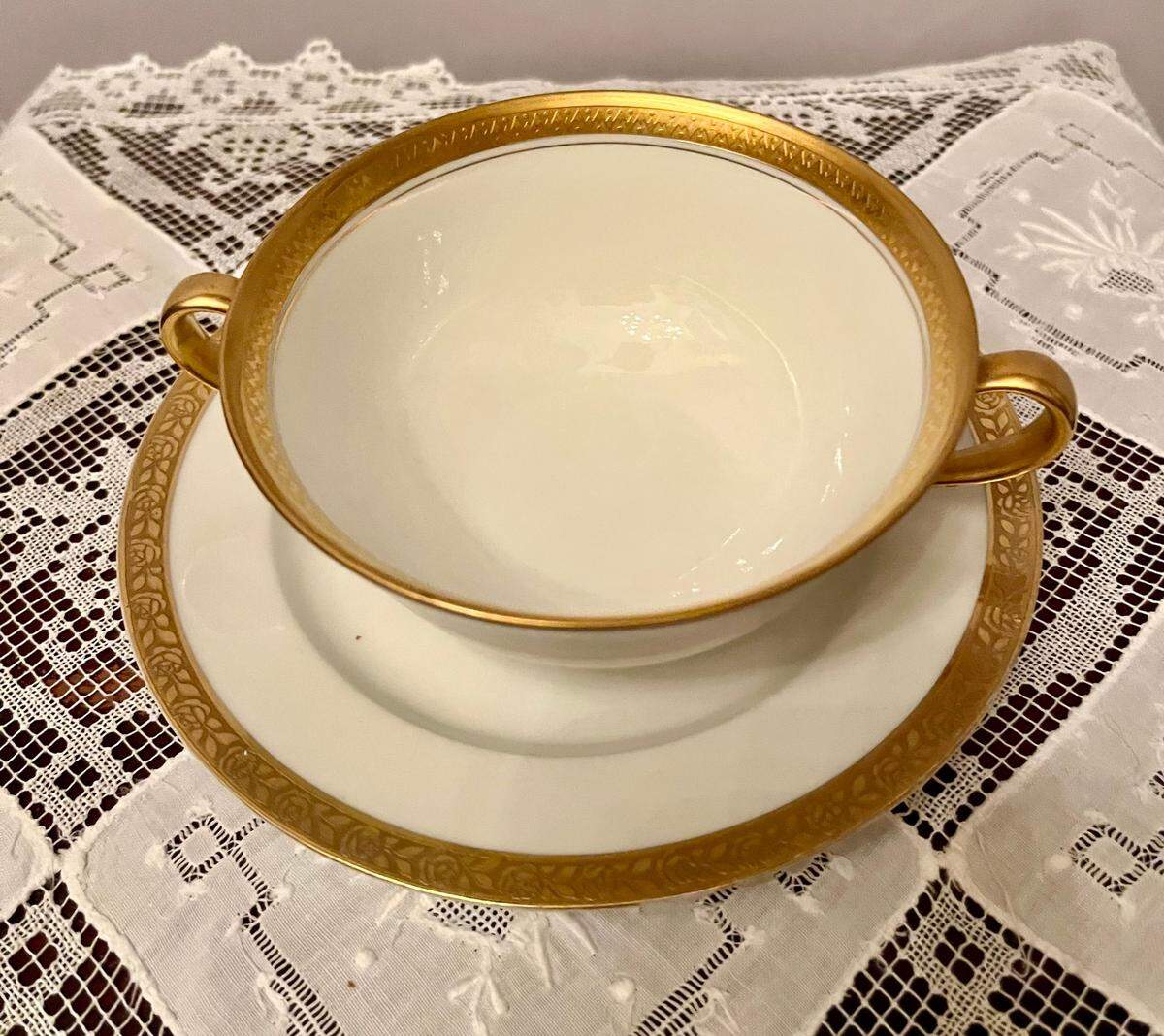 This china cream soup bowl and saucer&nbsp;does not have a pattern, just the gold trim.