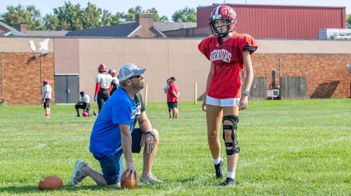 Granite City varsity kicker Abby Knight practices with her father, Craig Knight.