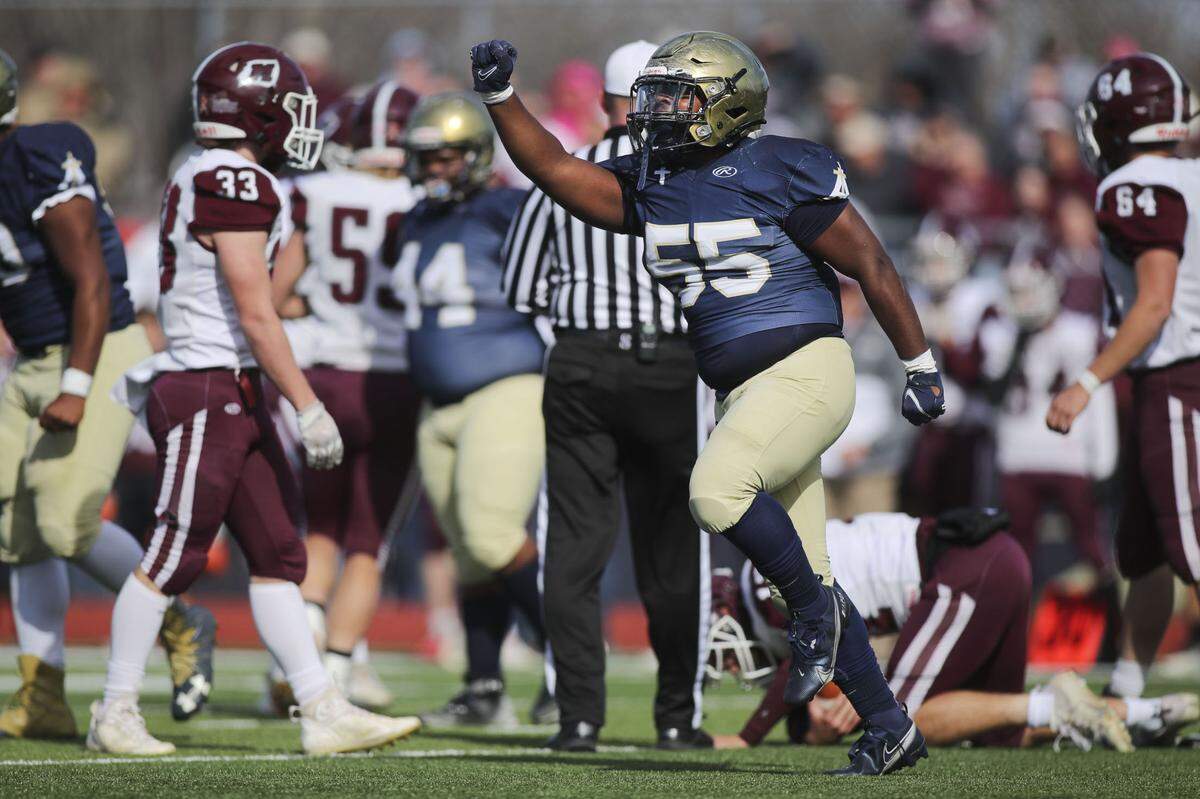 Althoff’s Chris Hobson celebrates after sacking Red Bud quarterback Dylan Oliver during an IHSA Class 2A second round playoff game against Red Bud. The Crusaders prevailed 26-14 and now advance to the quarterfinal round.