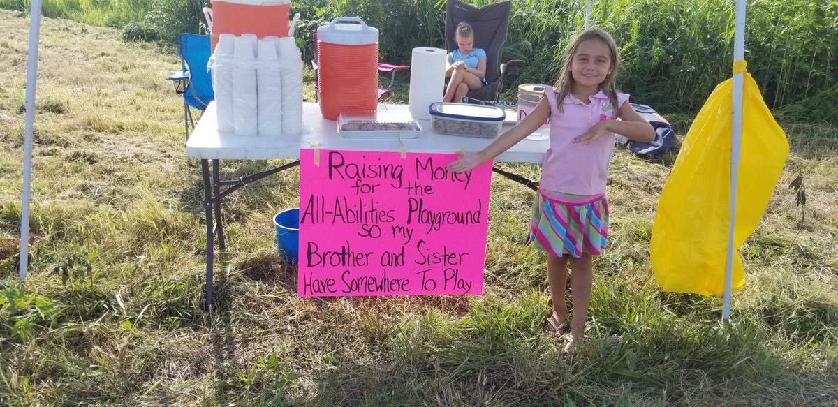 Emerson Daley stands at her lemon stand, which was located at the intersection of Wilderness Lane and Pocahontas Road in Grantfork on July 28. Emerson raise $1,100 for an all-abilities playground that is being built at Dennis H. Rinderer Park in Highland.