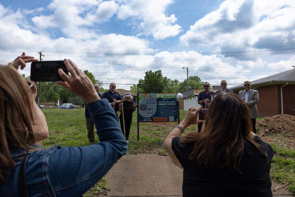 Former Belleville Mayor Patty Gregory and C.A. Jones representatives pose in 2024 in a vacant lot at 25 Queensway Drive, where a home was being built as part of the city’s Infill Redevelopment Program.