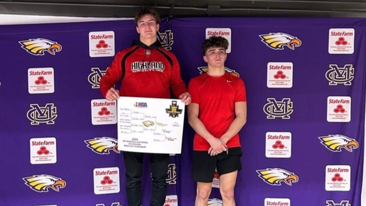 Highland’s Tyson Rakers on the podium with Jacksonville’s Joseph Ref after winning the 150-pound championship at the Class 2A Triad Regional last Saturday.