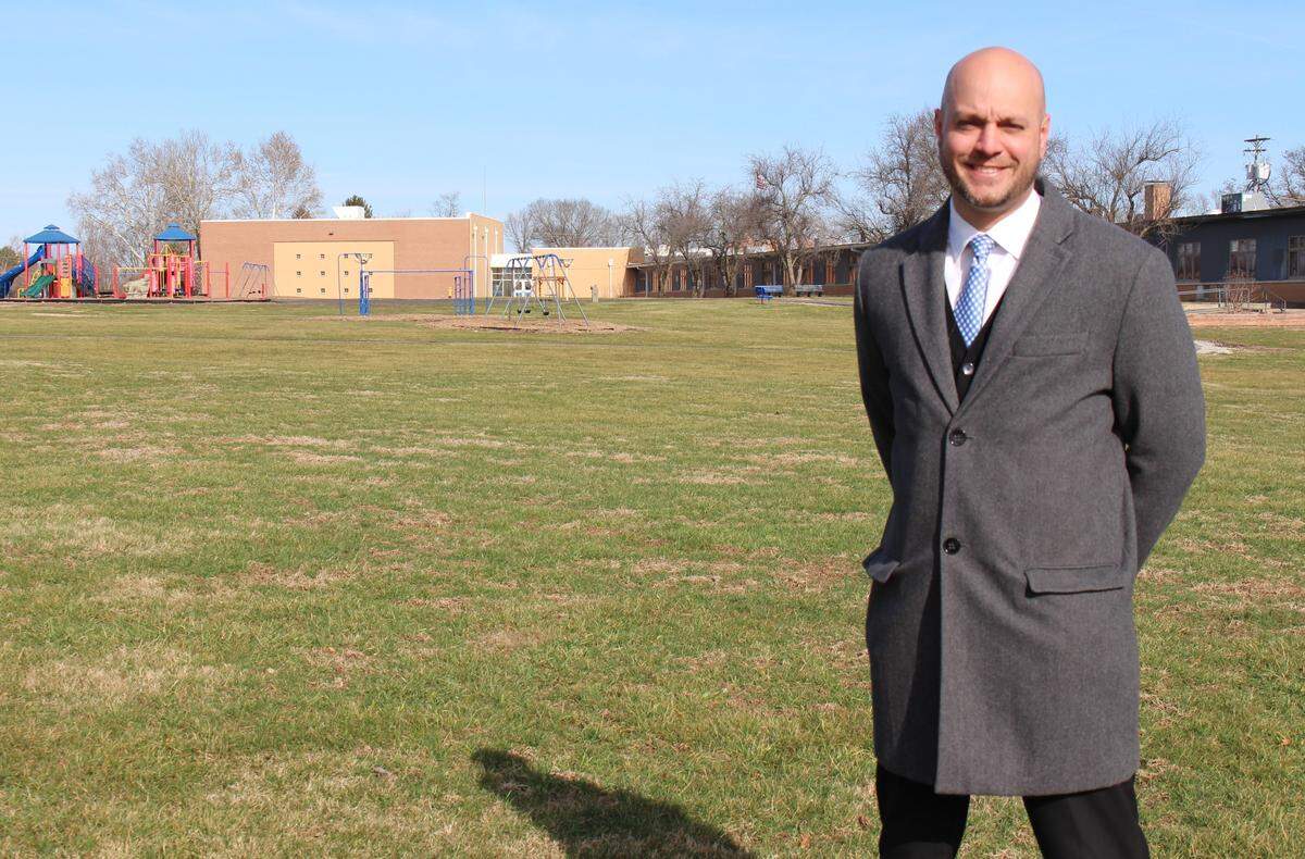 Dave Deets, superintendent of Harmony-Emge School District 175, stands in a field that will soon be filled with ground-mounted solar panels to provide electricity for Ellis Elementary School in Belleville.