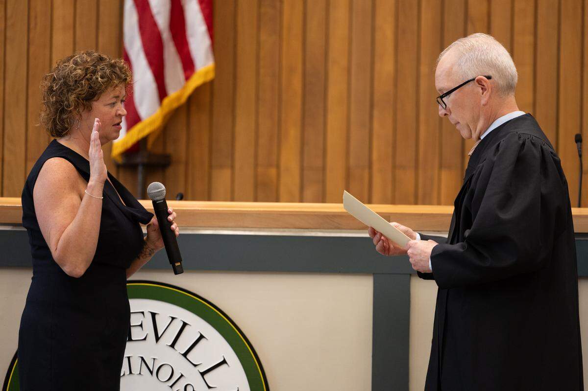 St. Clair County Circuit Court Associate Judge Chris Kolker swears in Jenny Gain Meyer, 49, as Belleville’s new mayor on Wednesday in City Council chambers at City Hall.
