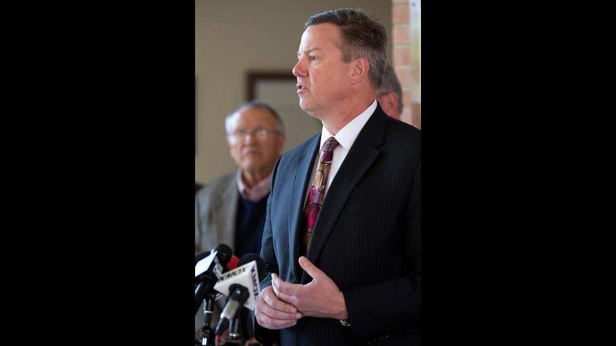 Columbia Mayor Kevin Hutchinson and other regional mayors speak in 2015 at Belleville City Hall about proposed state budget cuts.