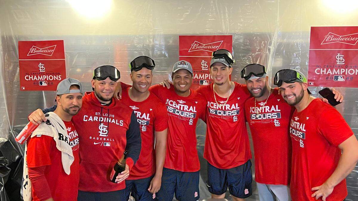 Members of the St. Louis Cardinals are all smiles after defeating the Brewers and securing the organization’s 12th Central Division crown last month.