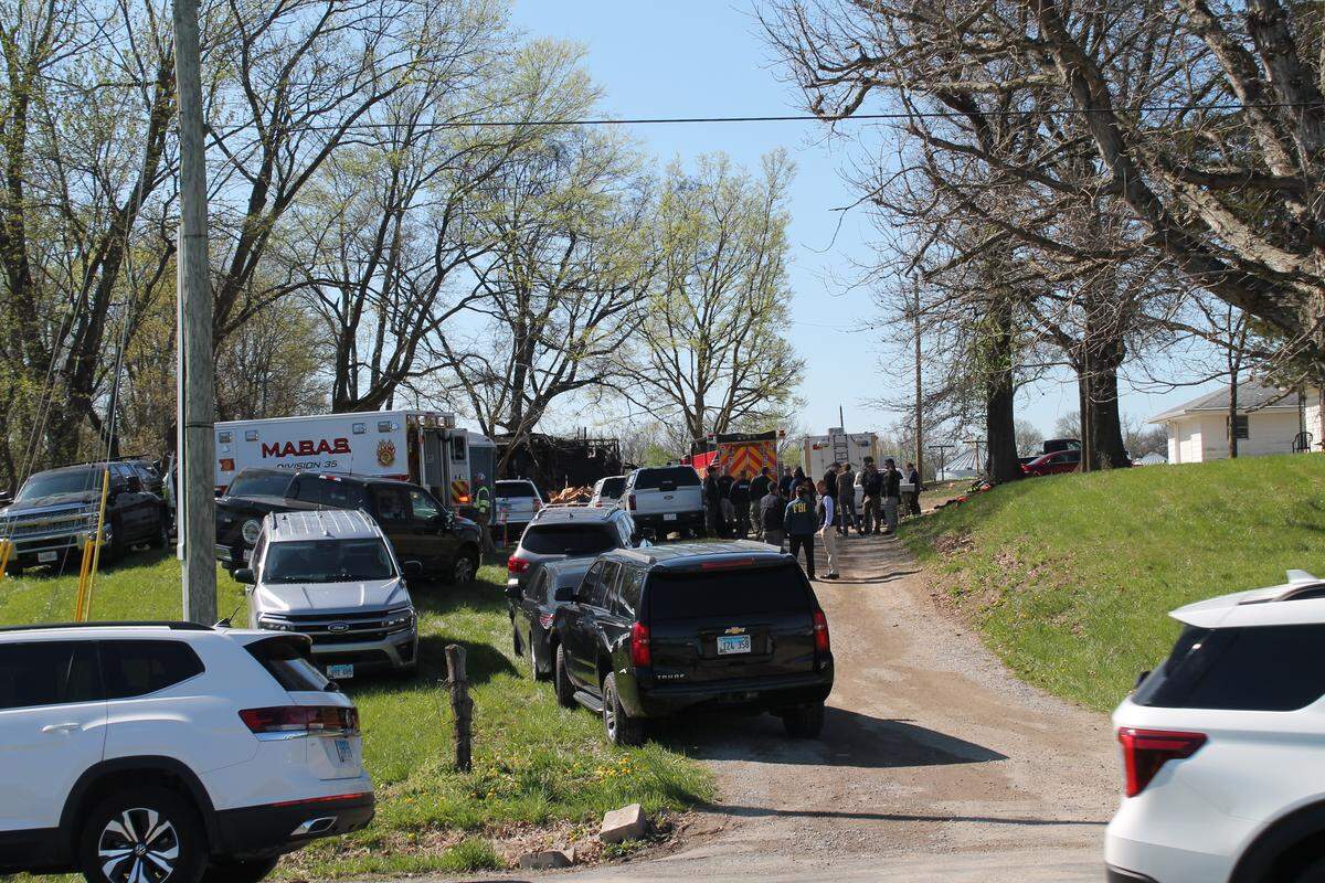 Law enforcement and public safety authorities gather at a home in the 8000 block of West Kirsch Road near Troy after an explosion and fire led to the deaths of three Sunday night.