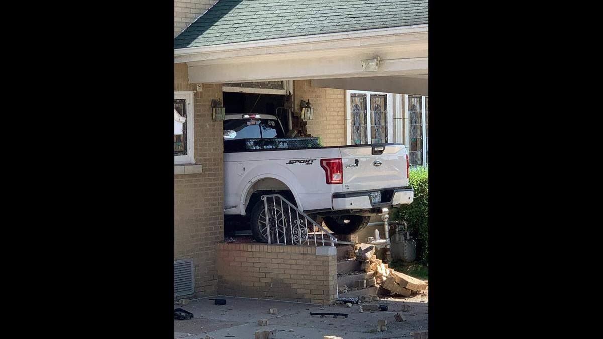 A white Ford truck that crashed into Kassly-Meridith Funeral Home in Collinsville on Aug. 22, 2021, remained lodged in the side of the building for two days.