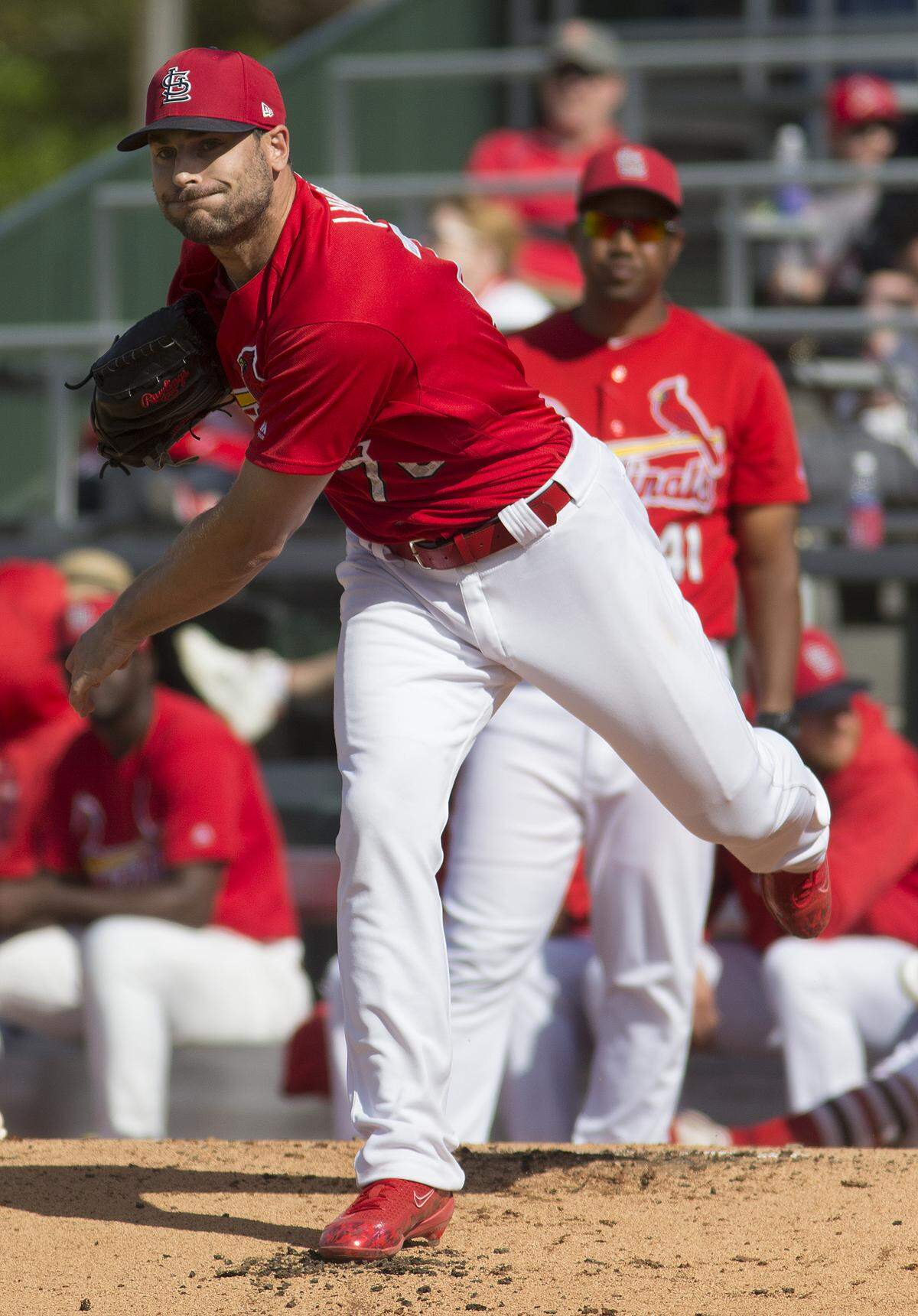 Relief pitcher Tyler Lyons warms up in the bullpen during a spring training game in Jupiter, Florida.