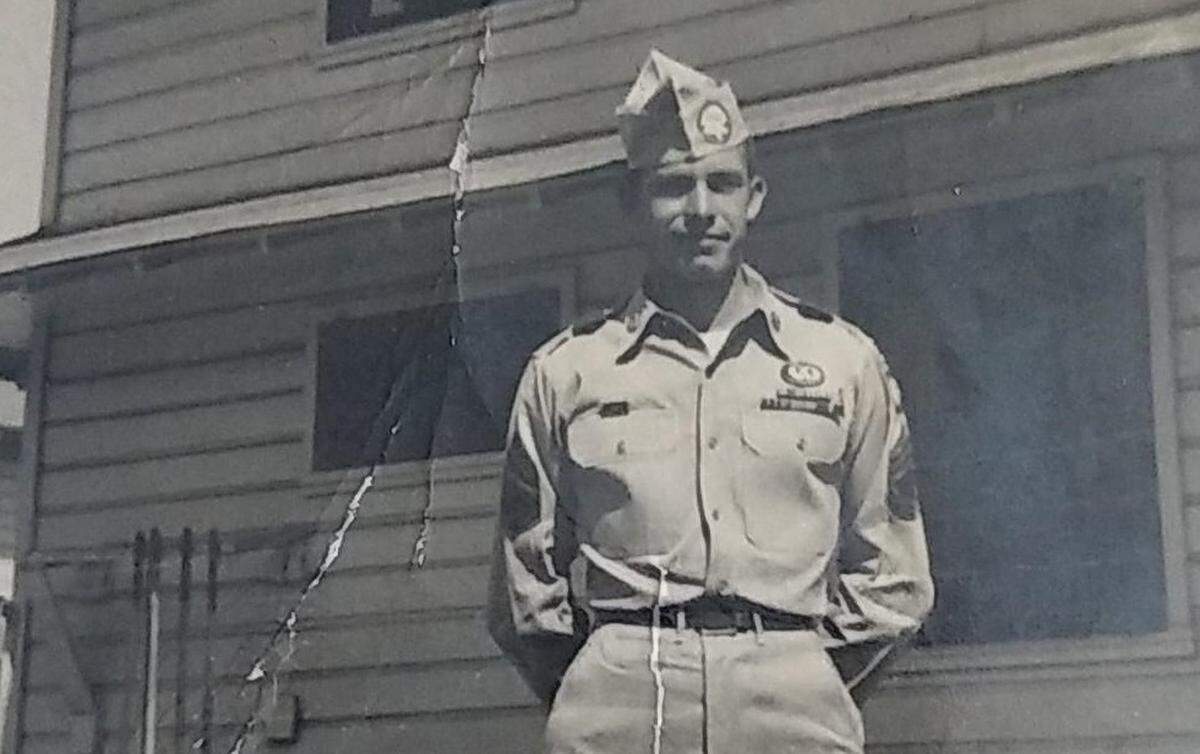 In this family photograph, Laurence Madden is wearing his military uniform. He served in the U.S. Army during the Korean War of the 1950s.