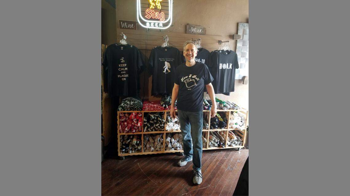 John Bigalke, owner of Beatnik’s in downtown Belleville, shows the “plague wear” at his store.