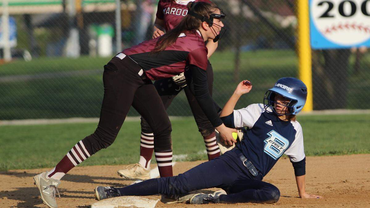 Belleville East courtesy runner Taylor St. Andre is tagged out at third base by Belleville West's Taylor Geluck during a Southwestern Conference game at East's Rita Menke Field on Tuesday.