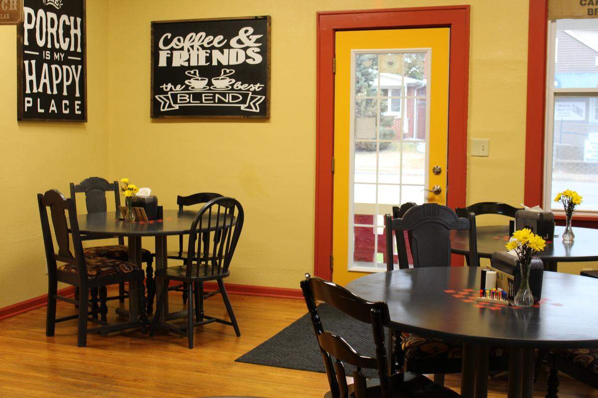 Tables at The Red Porch cafe in New Baden are stenciled with checkerboards in the center. Dominoes, chess, Scrabble and other games also are available.