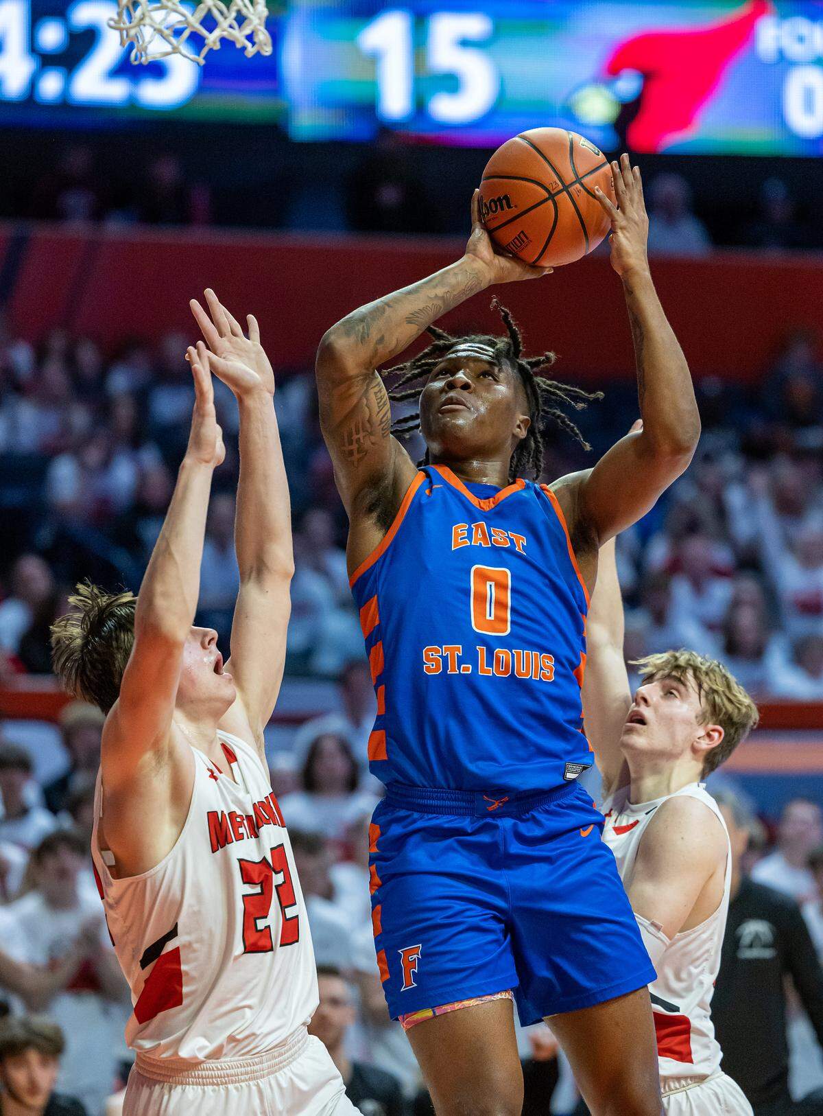 East St. Louis’ Macaleab Rich puts up a shot during Friday’s IHSA Class 3A state semifinal game against Metamora at State Farm Center in Champaign on the campus of the University of Illinois.
