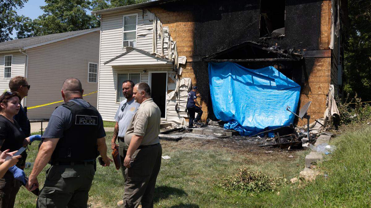 Outside of the scene of a crime where a car crashed into a house on South Eighth St. in Belleville on the morning of Aug. 11, 2024. A 23-year-old man was charged Tuesday with two counts of murder.