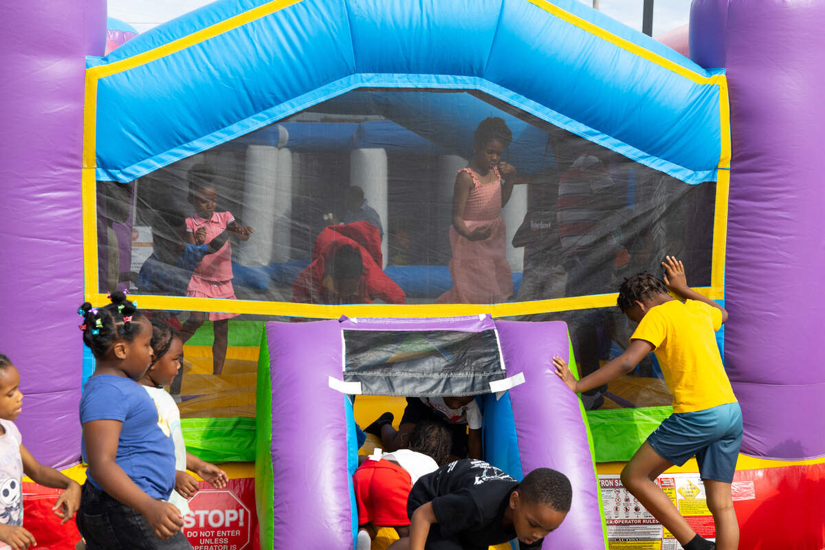 Children play during a large downtown block party in East St. Louis on June 18.