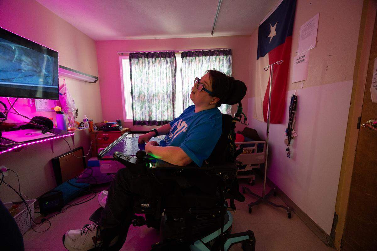 Jennifer Foushee sits in her room at Clinton Manor. Foushee has lived there for 13 years, but is yet to have her own room due to care requirements and administrative rules. “Imagine this is where you have to live for the past ten years,” Foushee, who also works as an on-the-job trainer at the facility, said. Despite having a job and a monthly stipend of roughly $700, Foushee is only allowed to keep $60, an increase from $30 in years past.