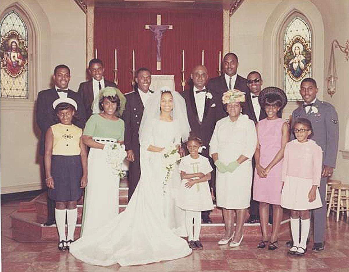 Mattie Malone poses with 11 of her 12 children at son Paul’s wedding in 1967 at St. Regis Church in East St. Louis.
