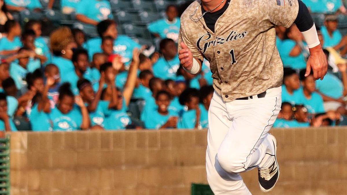 The Gateway Grizzlies’ Cody Livesay scores on an infield out in the first inning after doubling in his at bat against the Schaumburg Boomers on Tuesday night at GCS Ballpark. The Boomers scored a 4-3 victory over the Grizzlies. See a gallery of photos from the game at bnd.com.