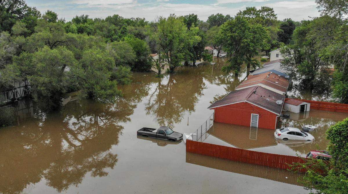 Almost 24 hours after most of the rain stopped in the region, homes and vehicles on Terrace Dr. in East St. Louis still remain flooded.
