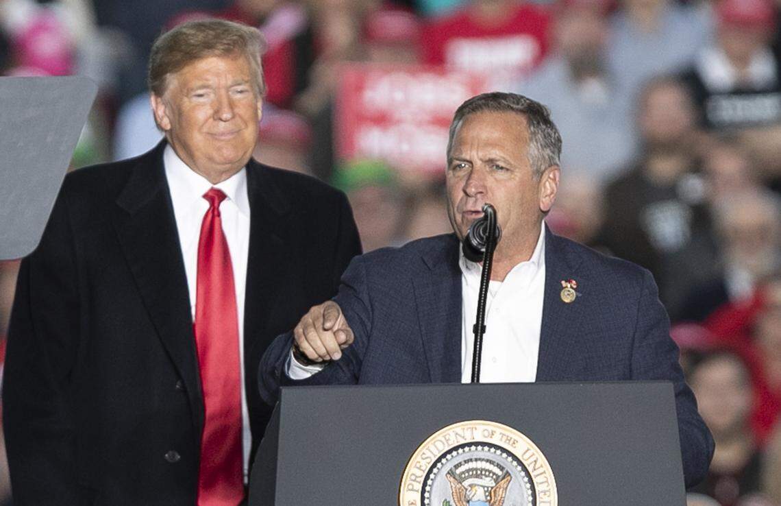 President Donald Trump listens as Congressman Mike Bost talks about how important his race for congress is.  President Trump and Congressman Bost were at the Make America Great Again rally in Murphysboro.  President Trump’s appearance was an effort to rally voters for Congressman Bost.