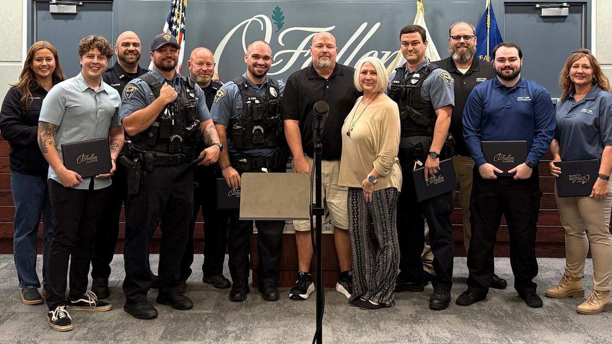 Honorees of Lifesaving Awards and Chief’s Commendations with survivor Matthew Burke and his wife Tiffany (center).