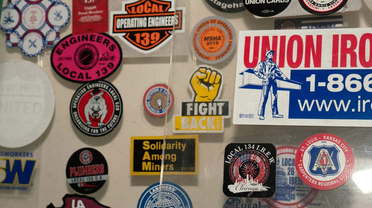 Hundreds of union pins and stickers line the Mother Jones museum in Mount Olive, Ill. on Sept. 12, 2024.