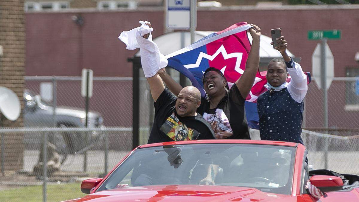 Holding a Juneteenth flag, participants in the East St. Louis Juneteenth celebration ride in a motorcade down State St. in East St. Louis on their way to city hall June 19, 2020. The metro-east again will host several Juneteenth events this Saturday, June 19.