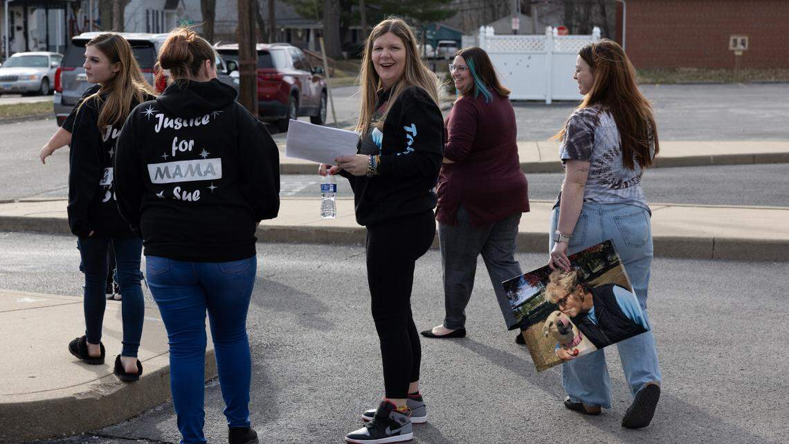 Courtney Tomlinson, center, celebrates with family and friends after a hearing at the Madison County Criminal Justice Center in Edwardsville. Her former boyfriend was sentenced to 50 years in prison for killing her mother by setting her Troy duplex on fire in 2022.