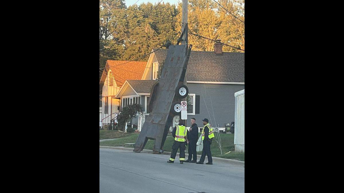 The Belleville Police and Fire Departments and workers from Ameren responded to East Main Street near the intersection of Florida Avenue to lower a large trailer that ended up leaning precariously against a utility pole Monday afternoon.