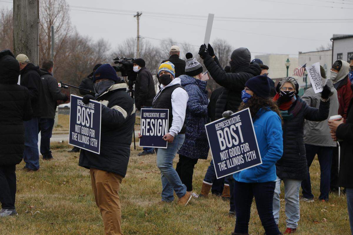 Nearly 50 demonstrators gathered at U.S. Representative Mike Bost’s O’Fallon office Saturday afternoon, calling for the congressman’s resignation. Bost represents Illinois’ 12th Congressional District.