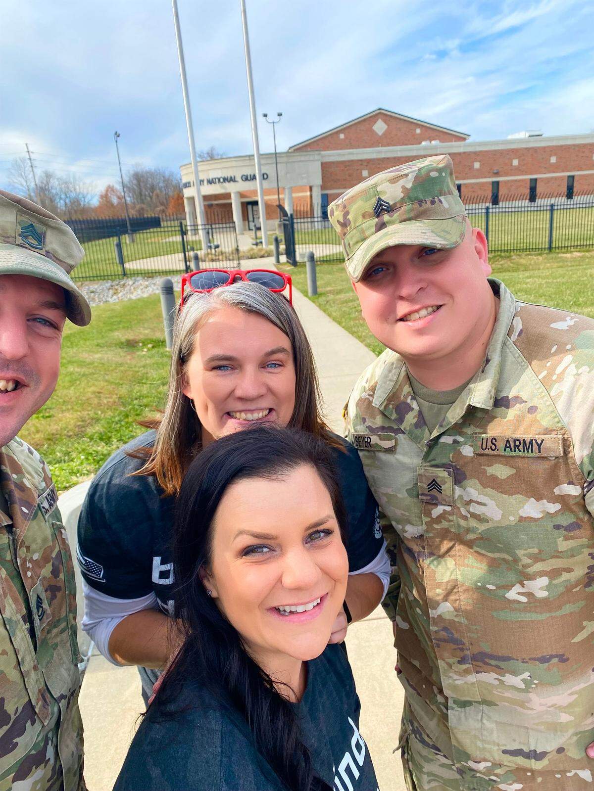Pictured are Alicia Steele, back, and Jessica Manfre, front, with military volunteers for GivingTuesdayMilitary. Manfre nominated Steele for the Military Spouse of the Year award, a contest sponsored by the Armed Forces Insurance to recognize outstanding contributions in all branches of service to the military community and the world.