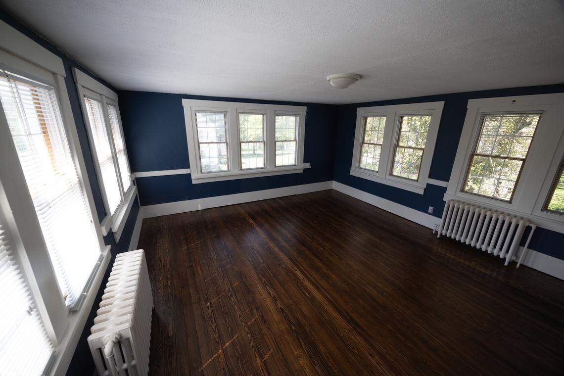The second-story bedroom features a wall of windows, two radiators and is comfortable in all seasons.