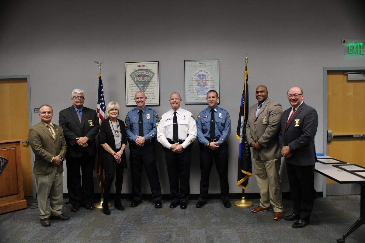 Pictured, Mike Mojzis, who had been serving as a patrol lieutenant, has been promoted to the rank of captain, and has taken over as the Support Services captain; Nick Stewart, who had been serving as a patrol sergeant, will now be a patrol lieutenant as he was promoted to lieutenant; and Joe Wagner was promoted to sergeant after having served as a senior officer on a patrol crew. They are shown with members of the Board of Police and Fire Commissioners.