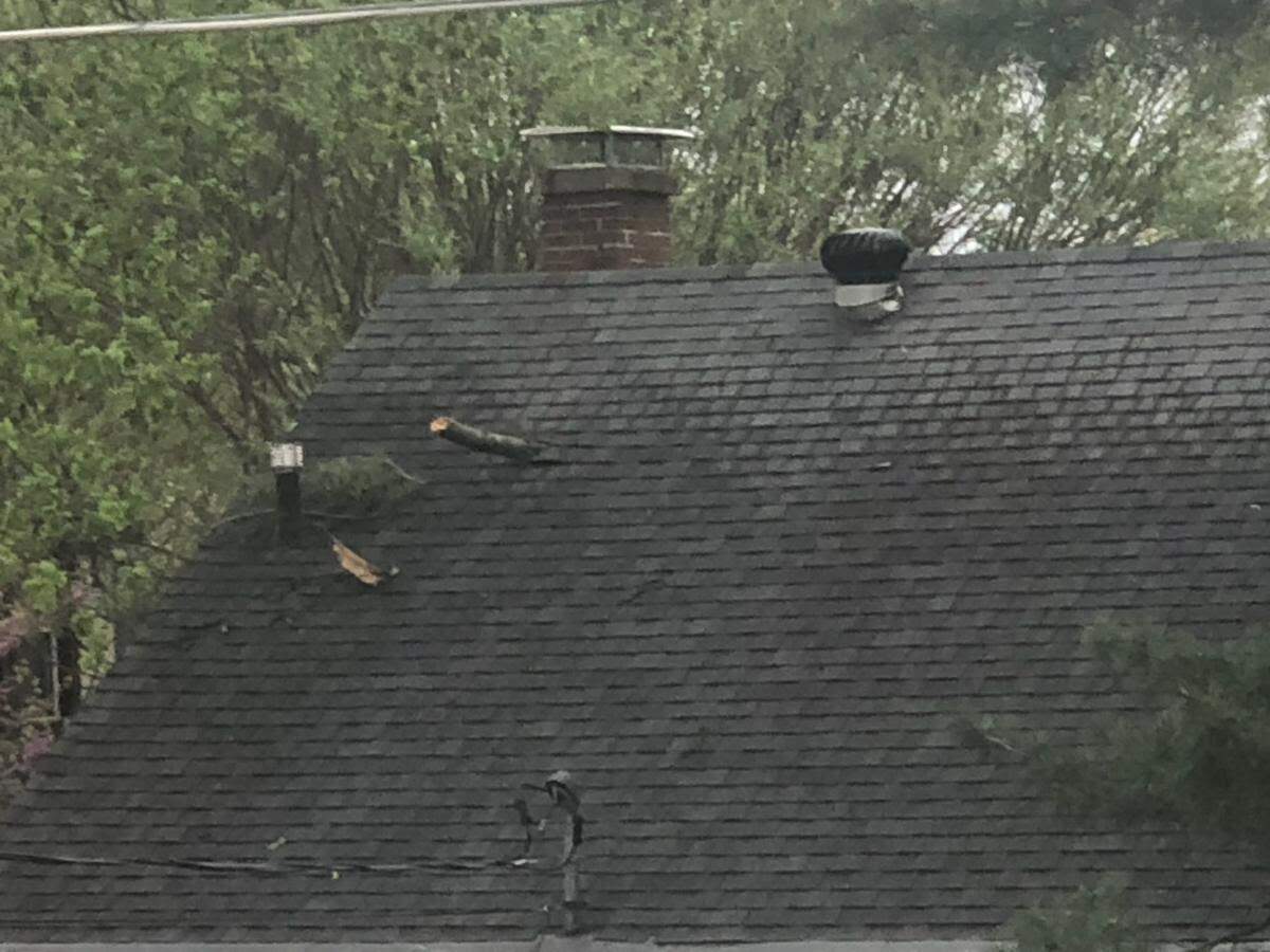 Damage to roof of house on Lebanon Avenue in Belleville following severe storms on Saturday, April 15, 2023.
