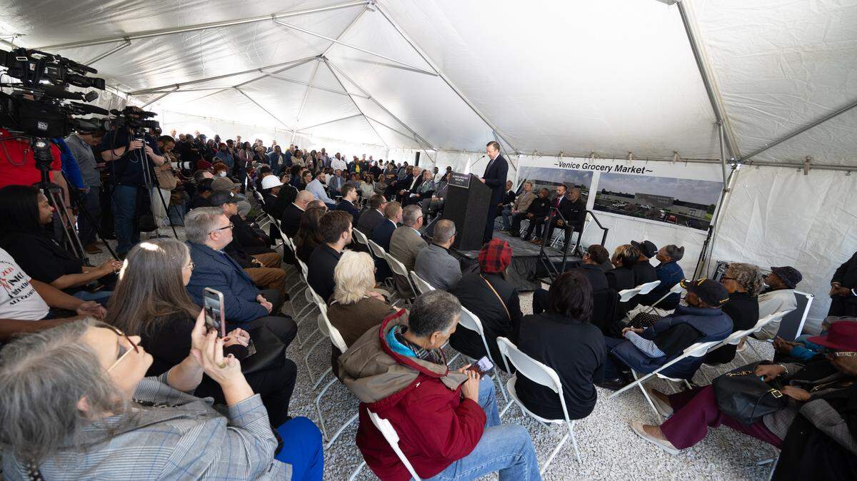 A crowd of hundreds filled a tent in Venice, Ill. on Wednesday to celebrate the groundbreaking ceremony of a future grocery store.