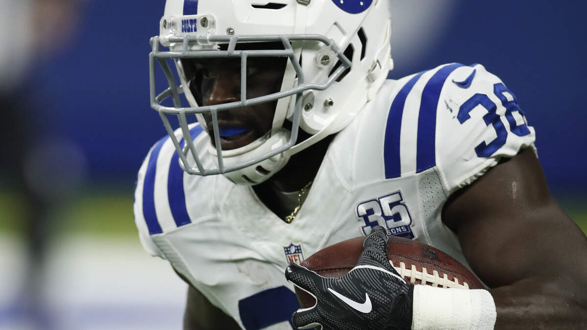 Indianapolis Colts running back Christine Michael (38) runs the ball against the Baltimore Ravens during an NFL preseason football game in Indianapolis, Monday, Aug. 20, 2018. The Ravens defeated the Colts 20-19. (Jeff Haynes/AP Images for Panini)