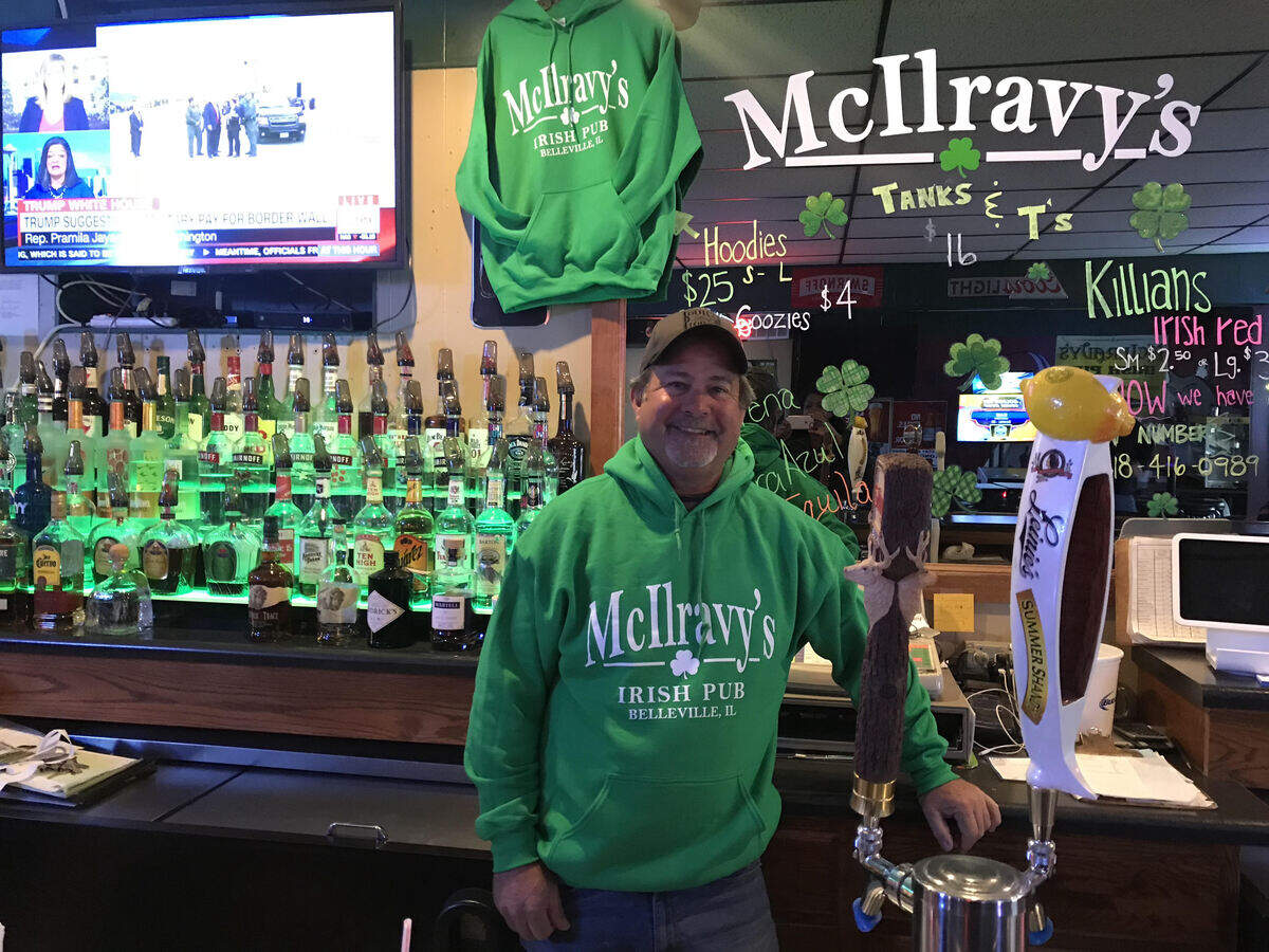 David McIlravy, owner of the new McIlravy's Irish Pub in west Belleville, stands behind the bar.