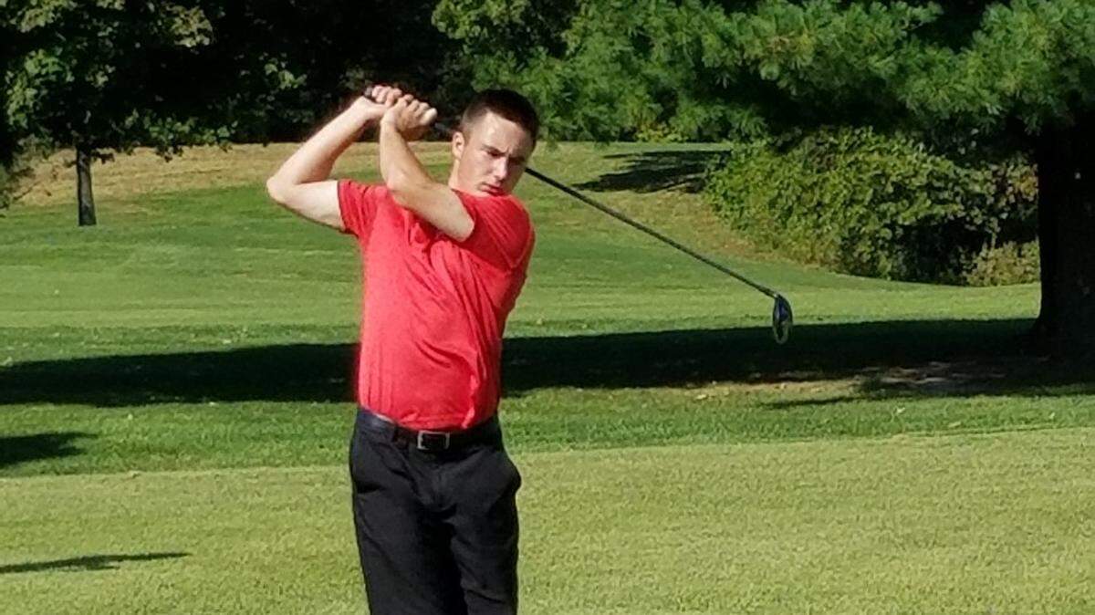Clayton Mallard of the Highland High School boys golf team completes a drive during the Class 2A sectional tournament at Hickory Ridge Golf Course in Carbondale on Monday, Oct. 8.