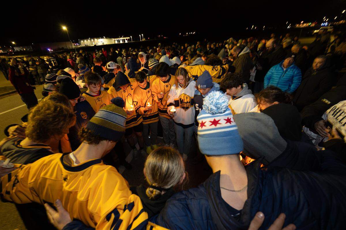 Teammates and opponents of CBC hockey player Colin Brown, 16, form in one of many prayer circles held in support of the teen, who was hit by a stray bullet while going home to O’Fallon after a hockey game with his father. Friends gathered for the vigil at the McKendree MetroRecplex in O’Fallon Monday.